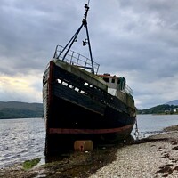 Buy canvas prints of Shipwreck on the beach at Corpach   by Jimmy Thomson