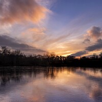 Buy canvas prints of Frozen Lake Sunset Sky Reflection. by Craig Yates