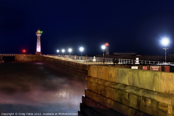 Whitby Lighthouse and Pier Night Shot Picture Board by Craig Yates