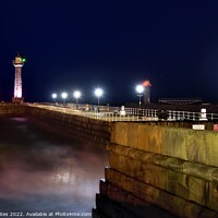 Buy canvas prints of Whitby Lighthouse and Pier Night Shot by Craig Yates
