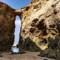Buy canvas prints of Perranporth Beach Rock Arch Cornwall. by Craig Yates