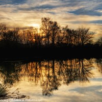 Buy canvas prints of Winter Sunset Reflection. by Craig Yates