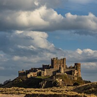 Buy canvas prints of Bamburgh Castle At Sunset by Craig Yates