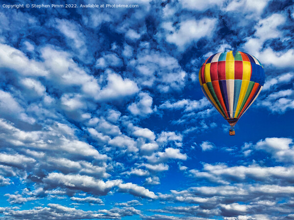 A colorful ballon flying in the sky Picture Board by Stephen Pimm