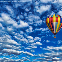 Buy canvas prints of A colorful ballon flying in the sky by Stephen Pimm