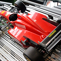 Buy canvas prints of Michael Schumacher’s Ferrari F310 V10 Replica by Ray Putley