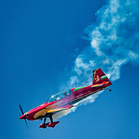Buy canvas prints of Royal Jordanian Falcons aircraft in dive with smoke by Mark Dunn