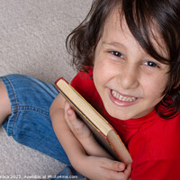 Buy canvas prints of Boy holding book as World book day concept by Turgay Koca