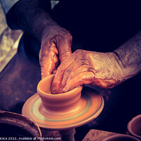 Buy canvas prints of Potter`s hands shaping up the clay by Turgay Koca