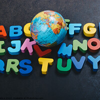 Buy canvas prints of Abc wooden alphabet letters and globe for learning by Turgay Koca