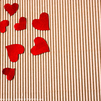 Buy canvas prints of Red color paper hearts on a brown cardboard by Turgay Koca