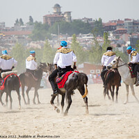 Buy canvas prints of Horseman riding in their ethnic clothes on horse   by Turgay Koca
