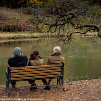 Buy canvas prints of People seat on wooden bench by the lake in nature by Turgay Koca