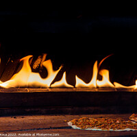 Buy canvas prints of The flames beside a pancake with spicy meat filling by Turgay Koca