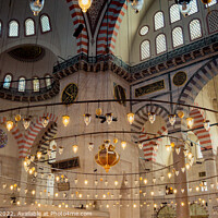 Buy canvas prints of Bright mosque lamps on a circular chandelier by Turgay Koca