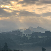 Buy canvas prints of Amazing sky over a misty morning by Tim Clapham