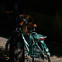 Buy canvas prints of Vintage Style Turquoise Ladies Bicycle Locked to a an urban Lamp Post. by Steve Gill