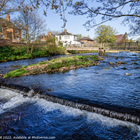 Buy canvas prints of River Skell with a Small Weir and a Footbridge. by Steve Gill