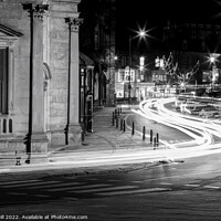 Buy canvas prints of Streaks of  Car Headlights Along a Street at Night by Steve Gill