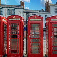 Buy canvas prints of A Row of Four Red Traditional Telephone Boxes. by Steve Gill