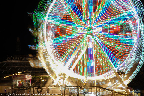 Ferris Wheel with Rotating kaleidoscopic Patterns. Picture Board by Steve Gill
