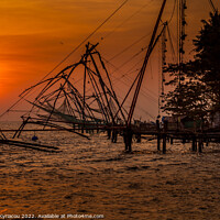 Buy canvas prints of Sunset over Cochin Fishing Nets in India by Vassos Kyriacou