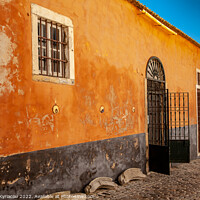 Buy canvas prints of Colourful old building in Faro Portugal by Vassos Kyriacou