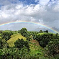 Buy canvas prints of Rainbow over Mount Warning  by Julie Gresty