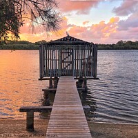 Buy canvas prints of Beach Hut Boat House on River Pink Sunset by Julie Gresty