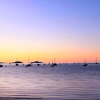 Buy canvas prints of Boats in Silhouette against a Rainbow Sunset by Julie Gresty