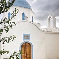 Buy canvas prints of Greek Chapel with Blue Dome Lefkes, Paros,  Greece by Julie Gresty