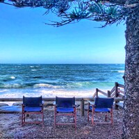 Buy canvas prints of Blue Chairs Looking Out to Sea by Julie Gresty