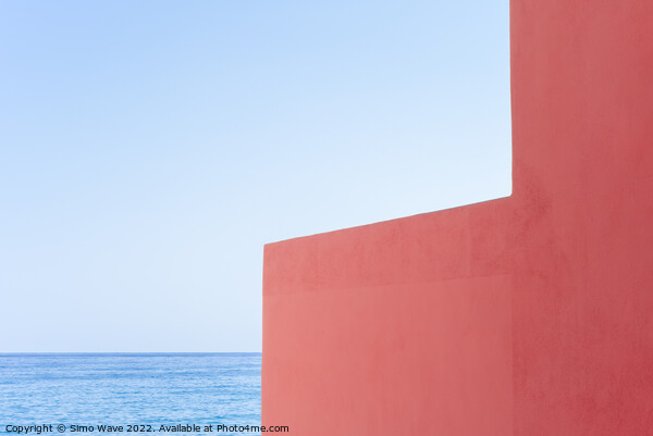 Pink wall against blue sea and sky Picture Board by Simo Wave