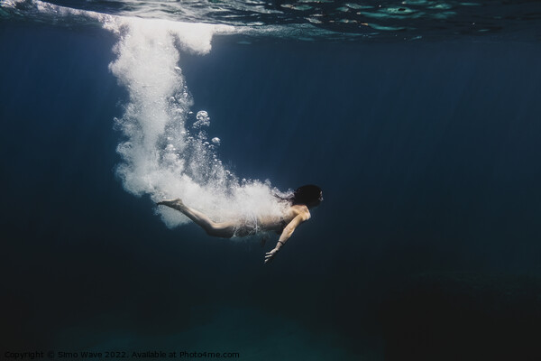 Woman diving underwater Picture Board by Simo Wave