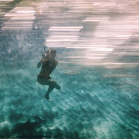 Buy canvas prints of Woman diving underwater for snorkeling by Simo Wave