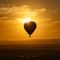 Buy canvas prints of Sunrise over Hot Air Balloon by David Aspinall