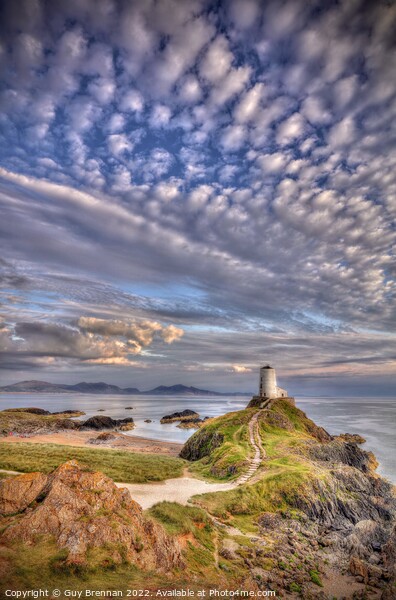 Llanddwyn lighthouse Anglesey  Picture Board by Guy Brennan