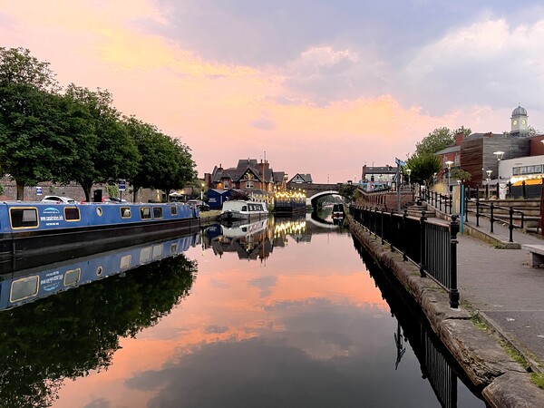 Sunset on busy canal Picture Board by Leonard Hall