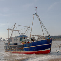 Buy canvas prints of Fishing boat being landed on beach by Sally Wallis