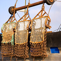 Buy canvas prints of Bow section of fshing boat with nets by Sally Wallis