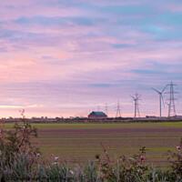 Buy canvas prints of Pylons and wind turbines at daybreak by Sally Wallis