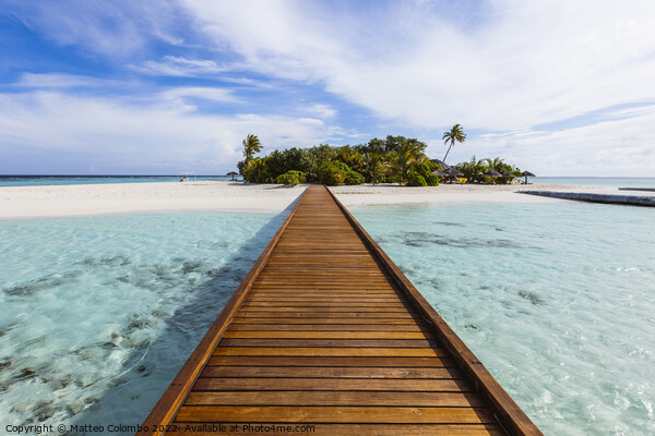 Wooden jetty to a tropical island, Maldives Picture Board by Matteo Colombo