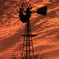 Buy canvas prints of Kansas Sunset with a colorful Sky with a Windmill  by Robert Brozek
