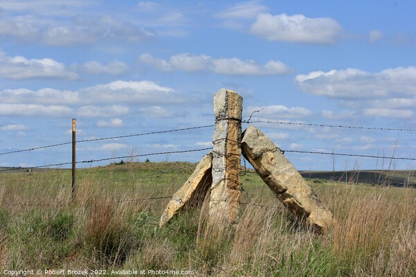 Stone Post corner fence with a field and blue sky Picture Board by Robert Brozek