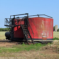 Buy canvas prints of  Red Oil Tank in a field with sky by Robert Brozek
