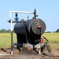 Buy canvas prints of Oil Well Storage Equipment in a field by Robert Brozek