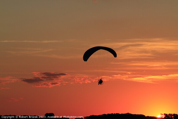 Paraglider at Sunset with a colorful sky. Picture Board by Robert Brozek