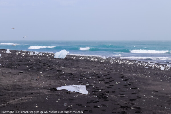 Diamond Beach in Iceland with blue icebergs melting on black san Picture Board by Michael Piepgras
