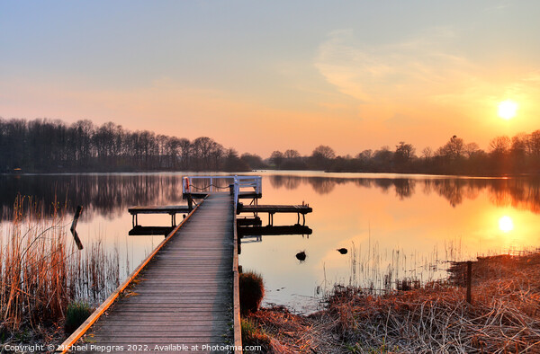 Beautiful and romantic sunset at a lake in yellow and orange col Picture Board by Michael Piepgras