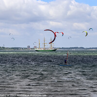 Buy canvas prints of Lots of kite surfing activity at the Baltic Sea beach of Laboe by Michael Piepgras
